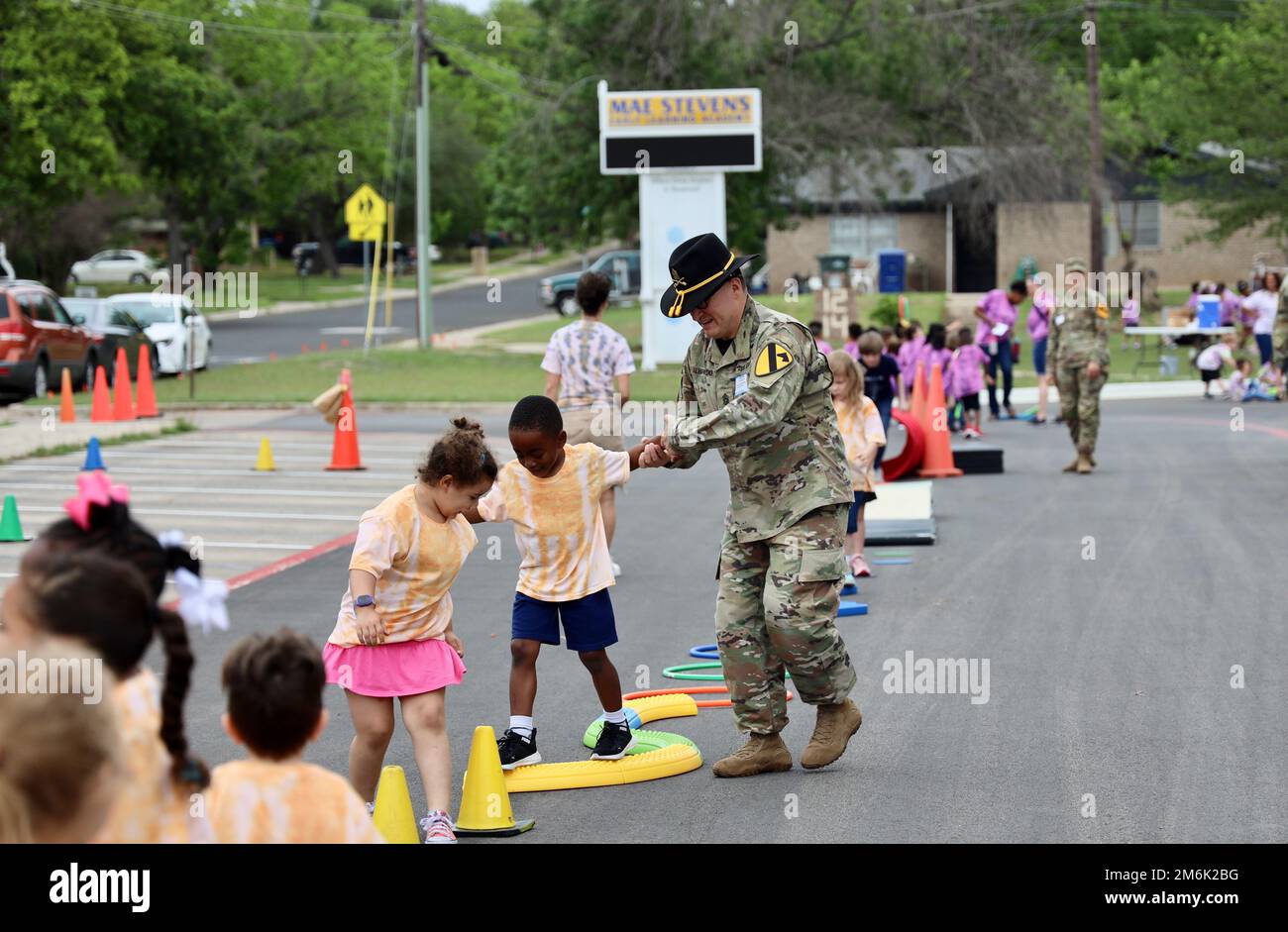 “I think maintaining a partnership in the community is important because Copperas Cove is so closely tied with Fort Hood,” said Command Sgt. Maj. Esteban Alvarado, Headquarters and Headquarters Battalion, 1st Cavalry Division command sergeant major as the unit volunteered at their Adopted School Mae Stevens Early Learning Academy in Copperas Cove, Texas on April 29 to host field day. “I tell my Soldiers all the time that this is our family. The vast majority of the students here are children of Soldiers and veterans. It is very important to build a strong bond at an early age so that when we a Stock Photo