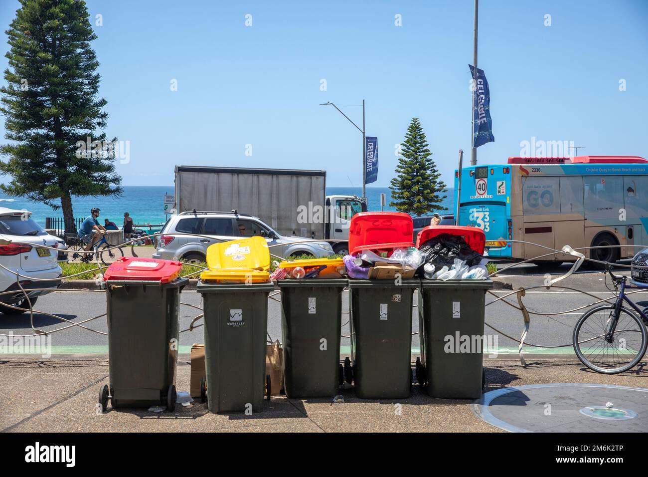 Bondi Beach Sydney street waste rubbish bins overflowing with rubbish as they await council