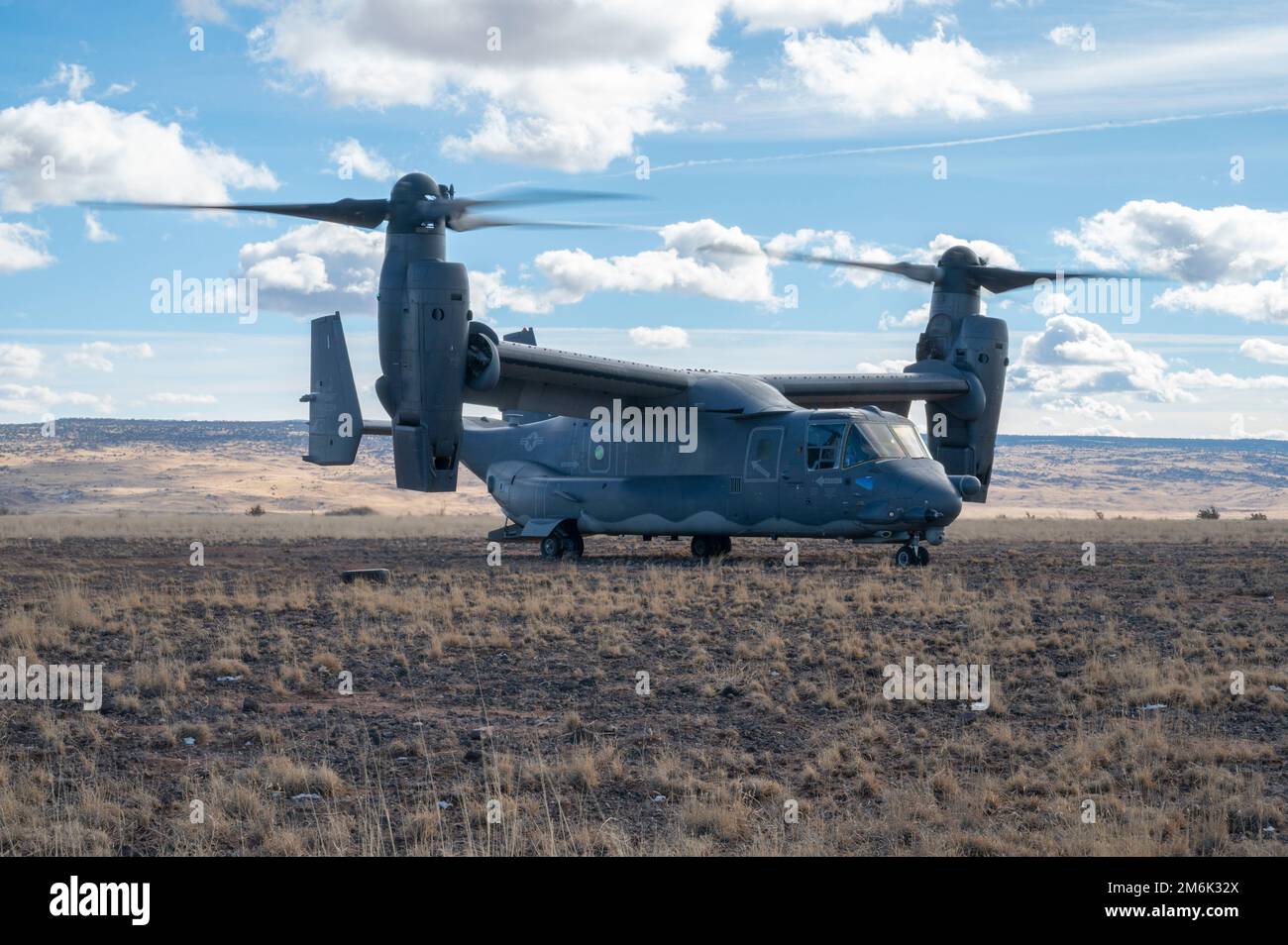 A CV-22 Osprey from the 71st Special Operations Squadron prepares to take flight from a designated landing zone in Albuquerque, New Mexico, December 29, 2022. The 71st SOS regularly conducts training flights as part of their mission to train warriors, professionalize Airmen, and employ airpower. (U.S. Air Force photo by A1C Ruben Garibay) Stock Photo