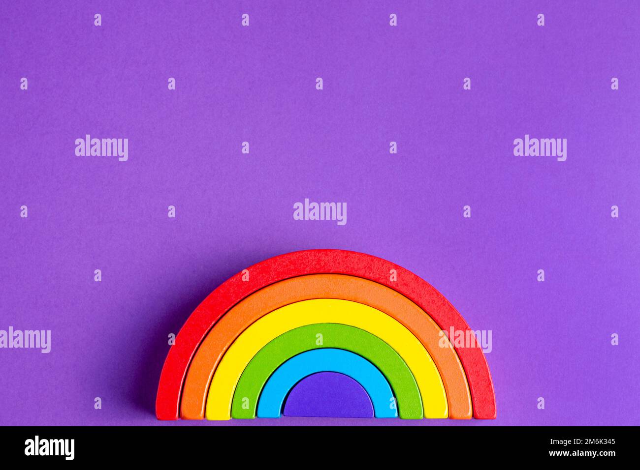 Colorful Waldorf wooden human figure rainbow in a montessori teaching