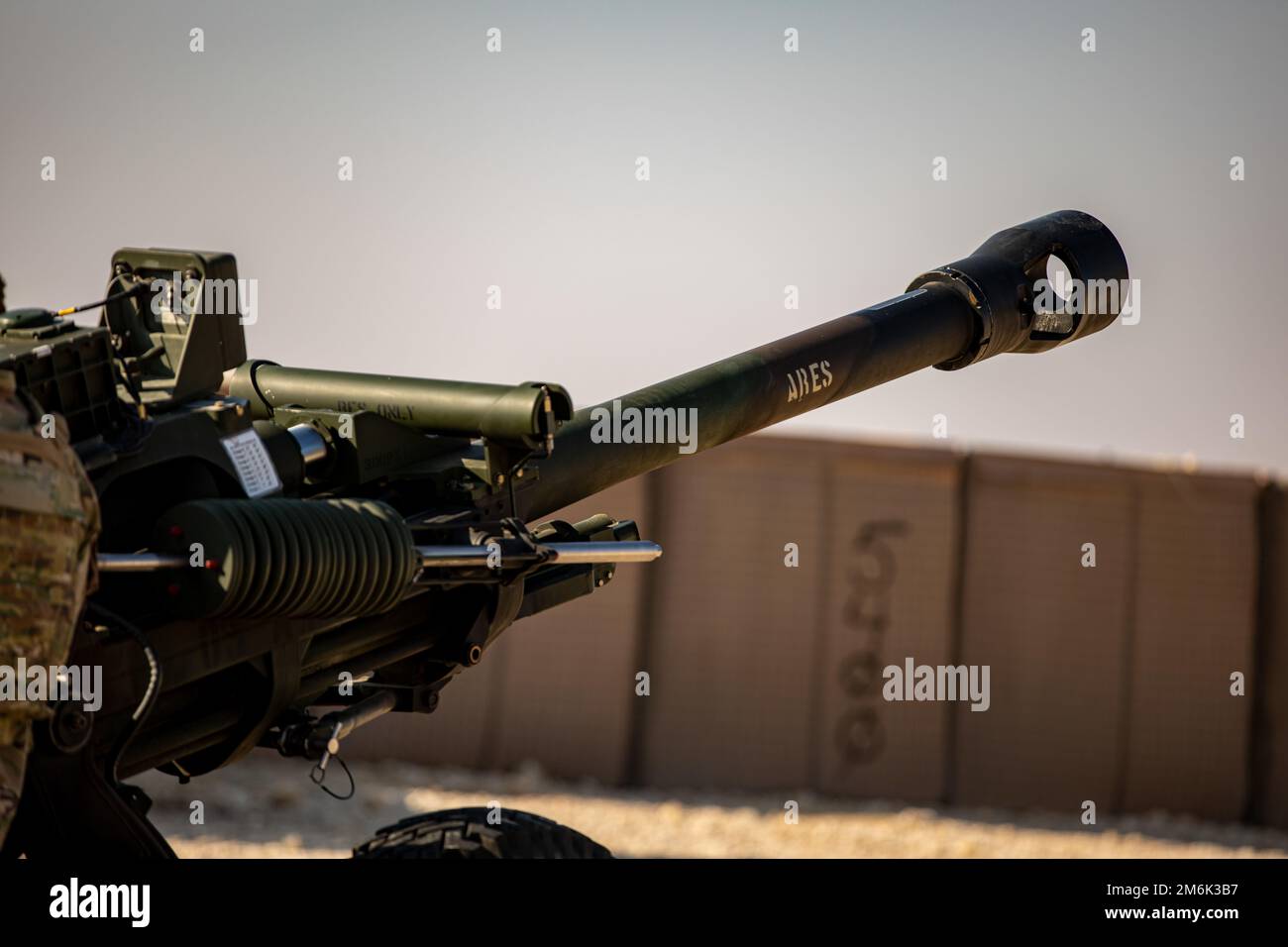 An M119A3 Howitzer, named “Ares,” assigned to Bravo Battery, 1st Battalion, 134th Field Artillery Regiment, 37th Infantry Brigade Combat Team, during an operational rehearsal exercise of an M119 howitzer, Al Asad Air Base, Iraq, Dec. 31, 2022. This exercise marks the first time the M119 howitzer has been fired by 1st battalion, 134th Field Artillery Regiment in Iraq. (U.S. Army photo by Sgt. Julio Hernandez) Stock Photo