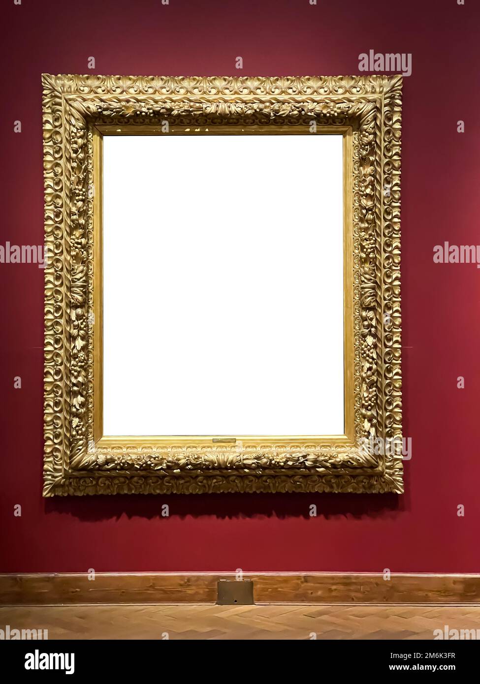 Antique golden art fair gallery frame on the wall at auction house or museum exhibition, blank template with empty white copyspa Stock Photo