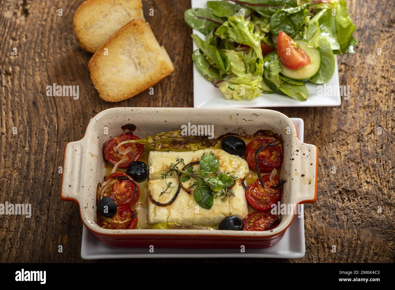 Grilled feta in casserole Stock Photo Alamy