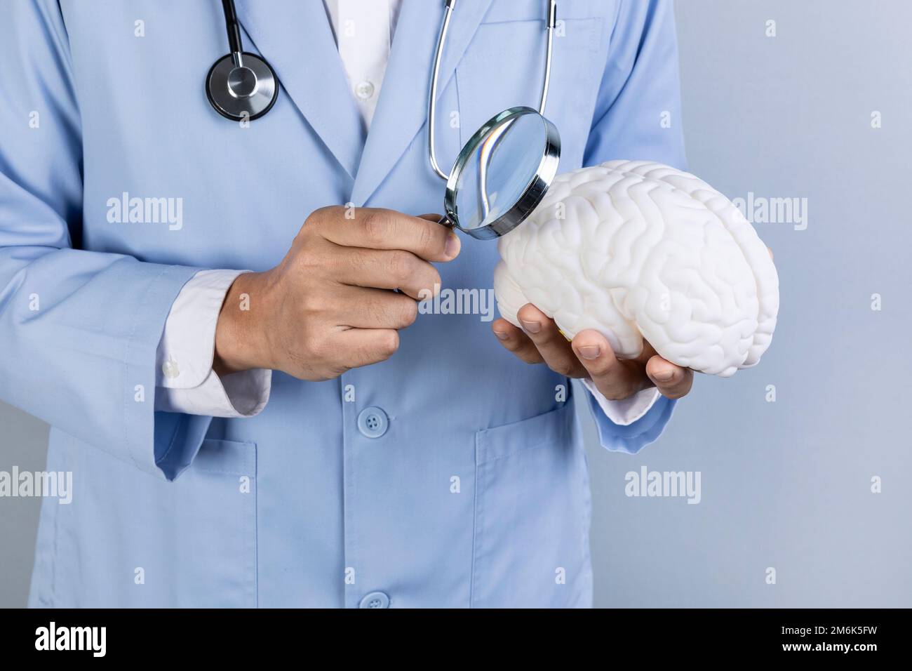 brain health and dementia series examine the brain with a magnifying ...