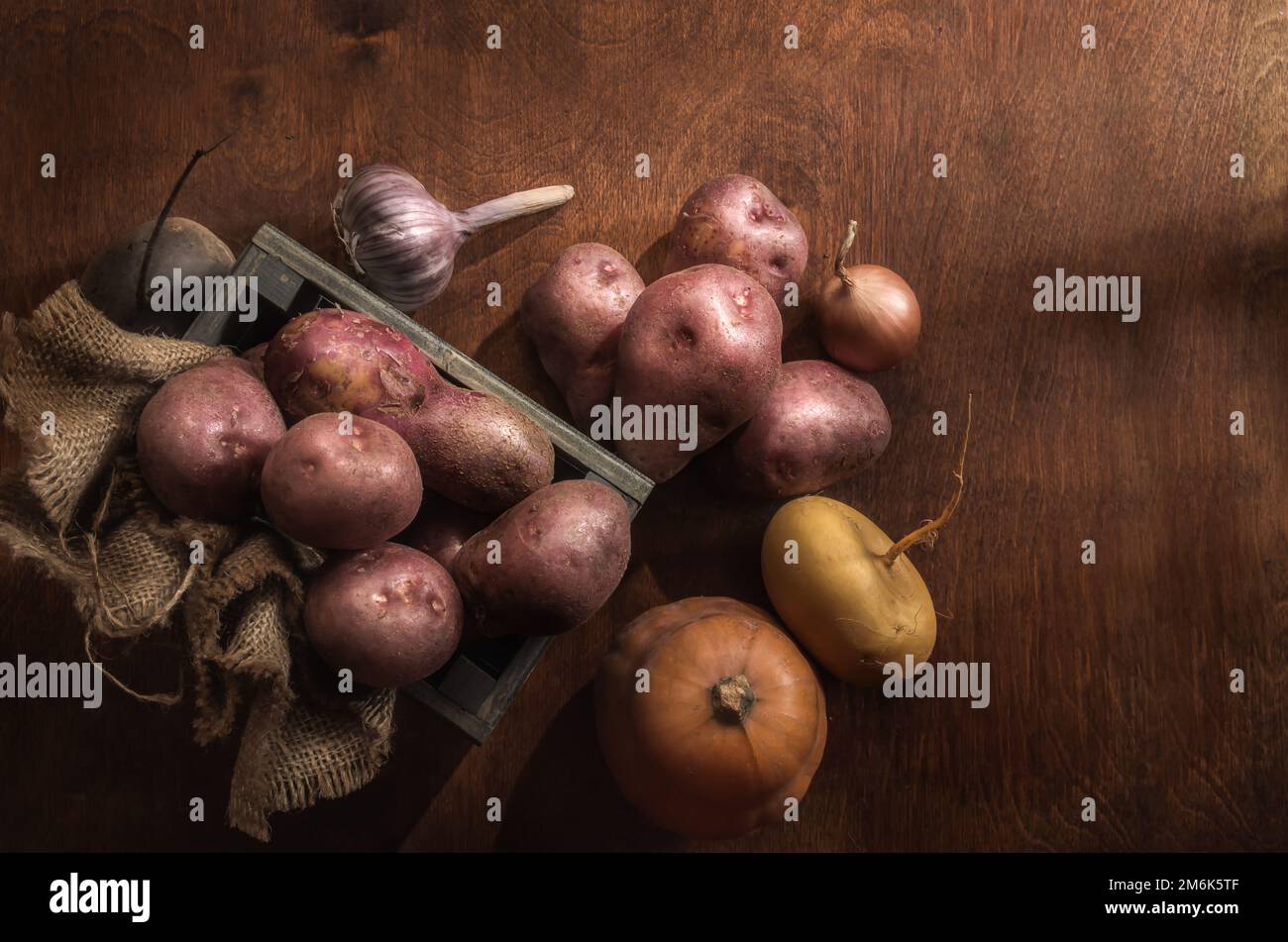 Root vegetables on a dark wooden background in a rustic style Stock ...