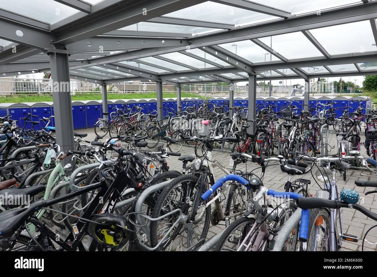 Bicycle garages and parking spaces at the station Stock Photo Alamy