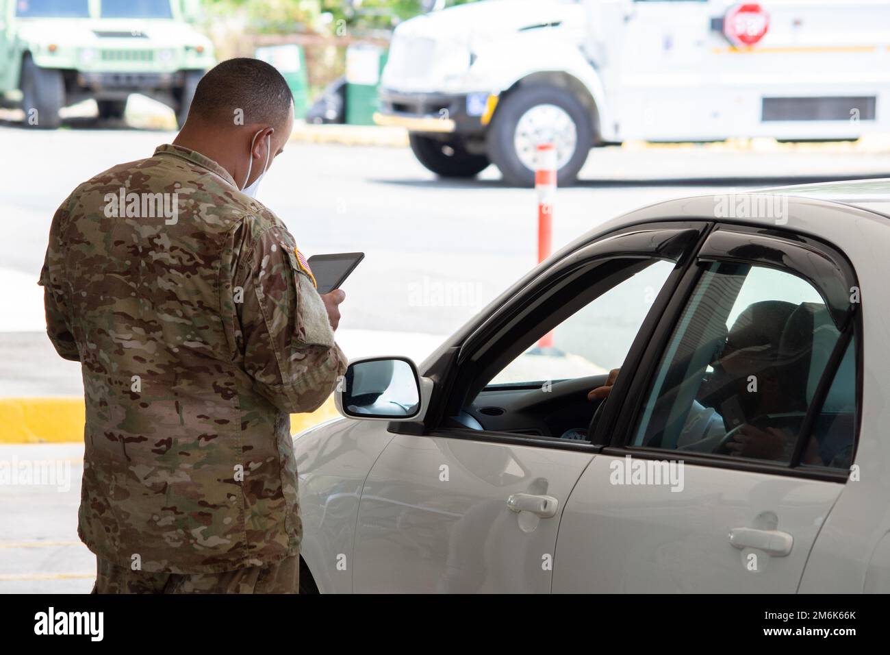 Spc. Fernando Acevedo of the Joint Task Force - Puerto Rico registers a citizen in Humacao, Puerto Rico, April 29, 2022. The Puerto Rico National Guard continued to assist the Department of Health to carry out Covid-19 tests throughout the island. Stock Photo