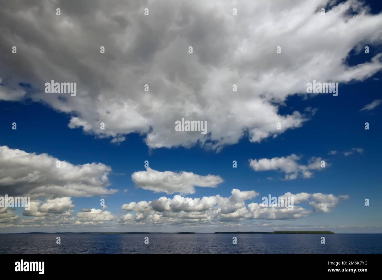 Blue sky with clouds over sea. Nature composition Stock Photo - Alamy