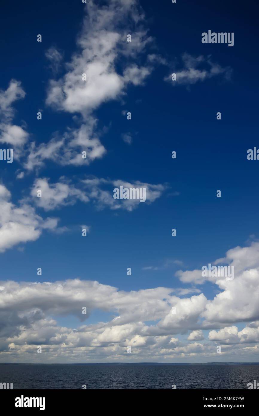 Blue sky with clouds over sea. Nature composition Stock Photo - Alamy