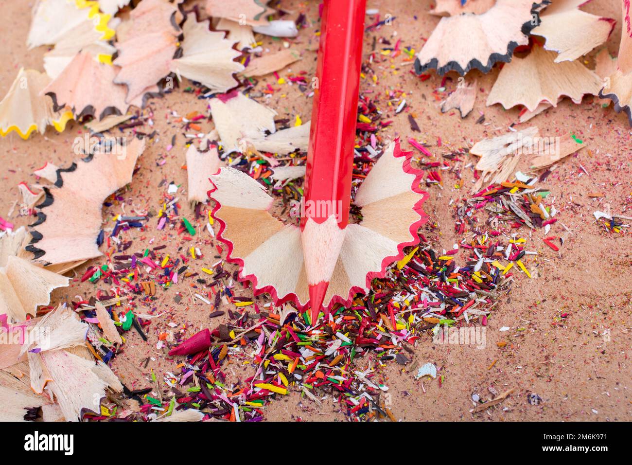 Red Color Pencil over pencil shavings Stock Photo Alamy