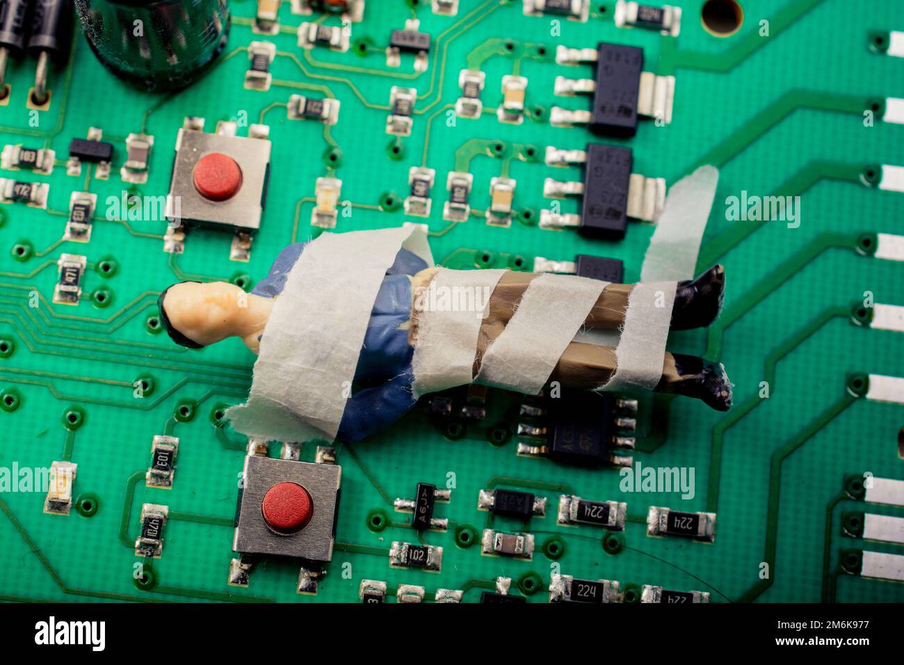 Tiny figurine of man model wrapped in bandages Stock Photo