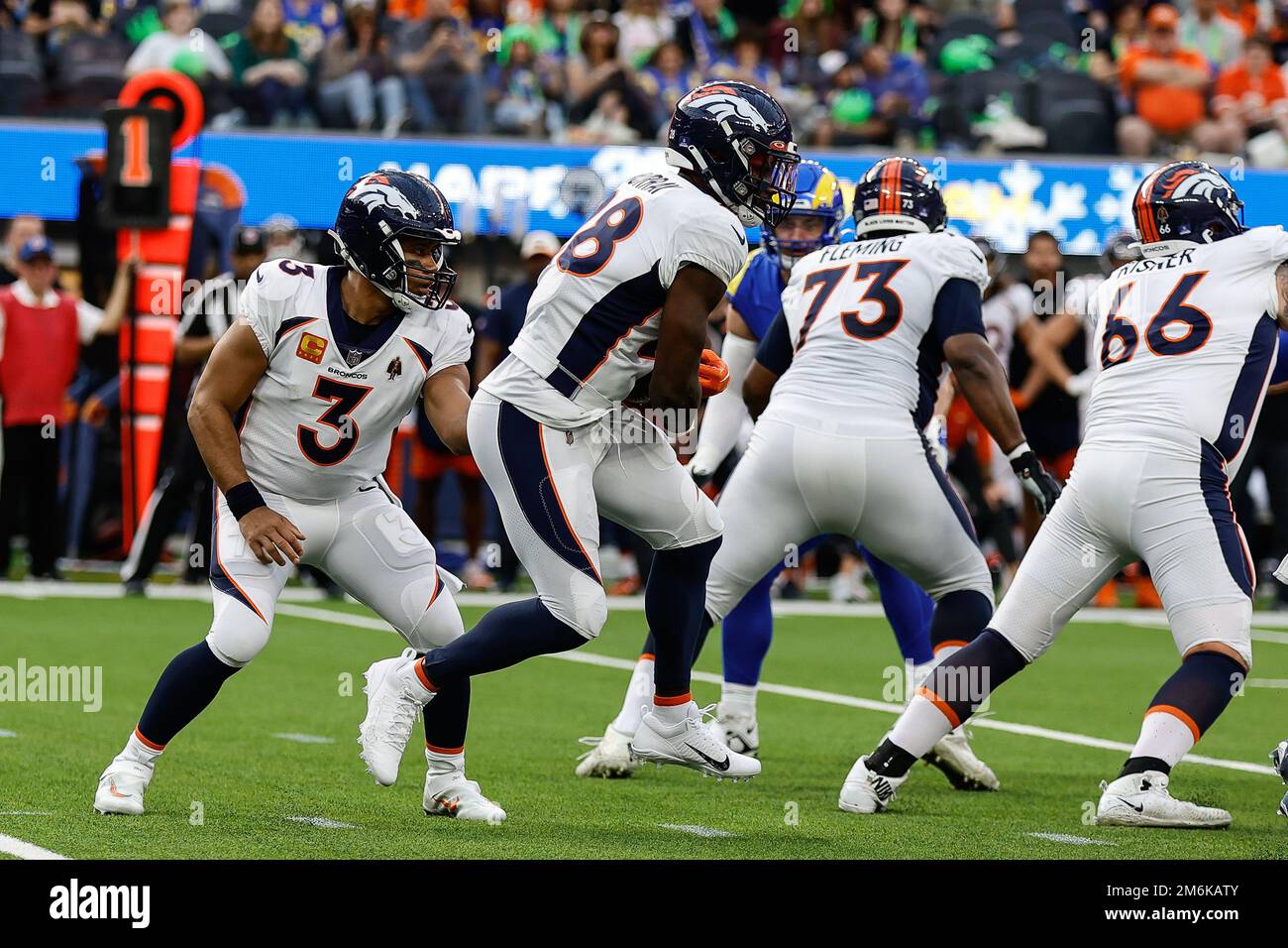 Denver, Colorado, USA. 1st Dec, 2019. Broncos RB PHILLIP LINDSAY starts to  take off his jersey to exchange with a Chargers player during the end of  the game at Empower Field At