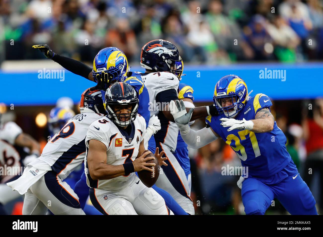INGLEWOOD, CA - DECEMBER 25: Denver Broncos quarterback Russell Wilson (3) under pressure in the pocket during the Denver Broncos vs Los Angeles Rams Stock Photo