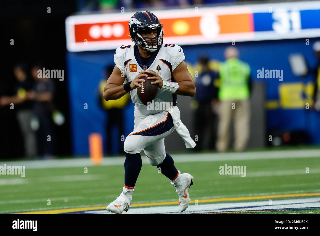 INGLEWOOD, CA - DECEMBER 25: Denver Broncos quarterback Russell Wilson (3)  rolls out during the Denver Broncos vs Los Angeles Rams at Sofi Stadium on  Stock Photo - Alamy