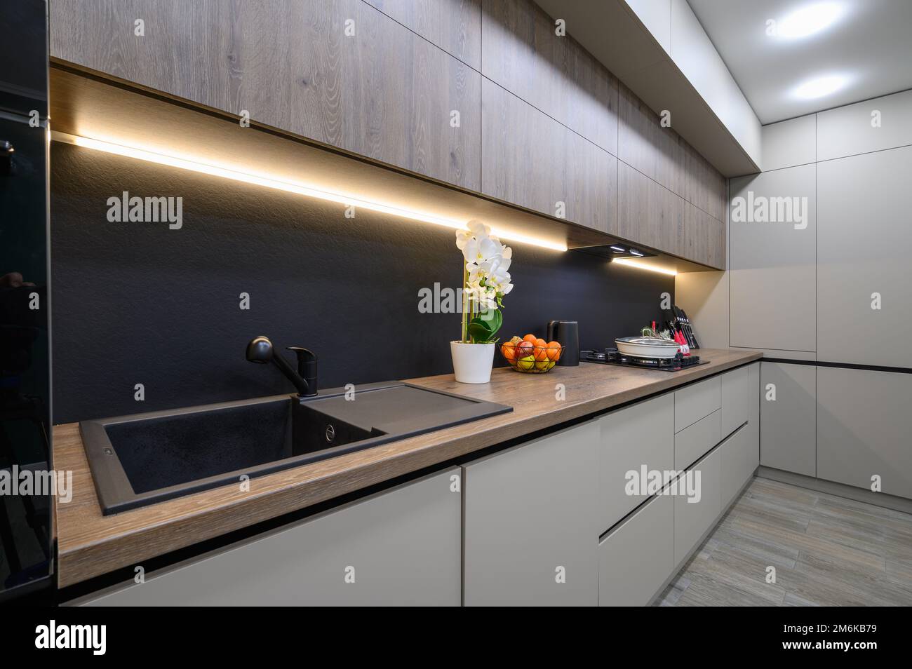 Trendy grey modern kitchen interior with minimalistic furniture Stock ...