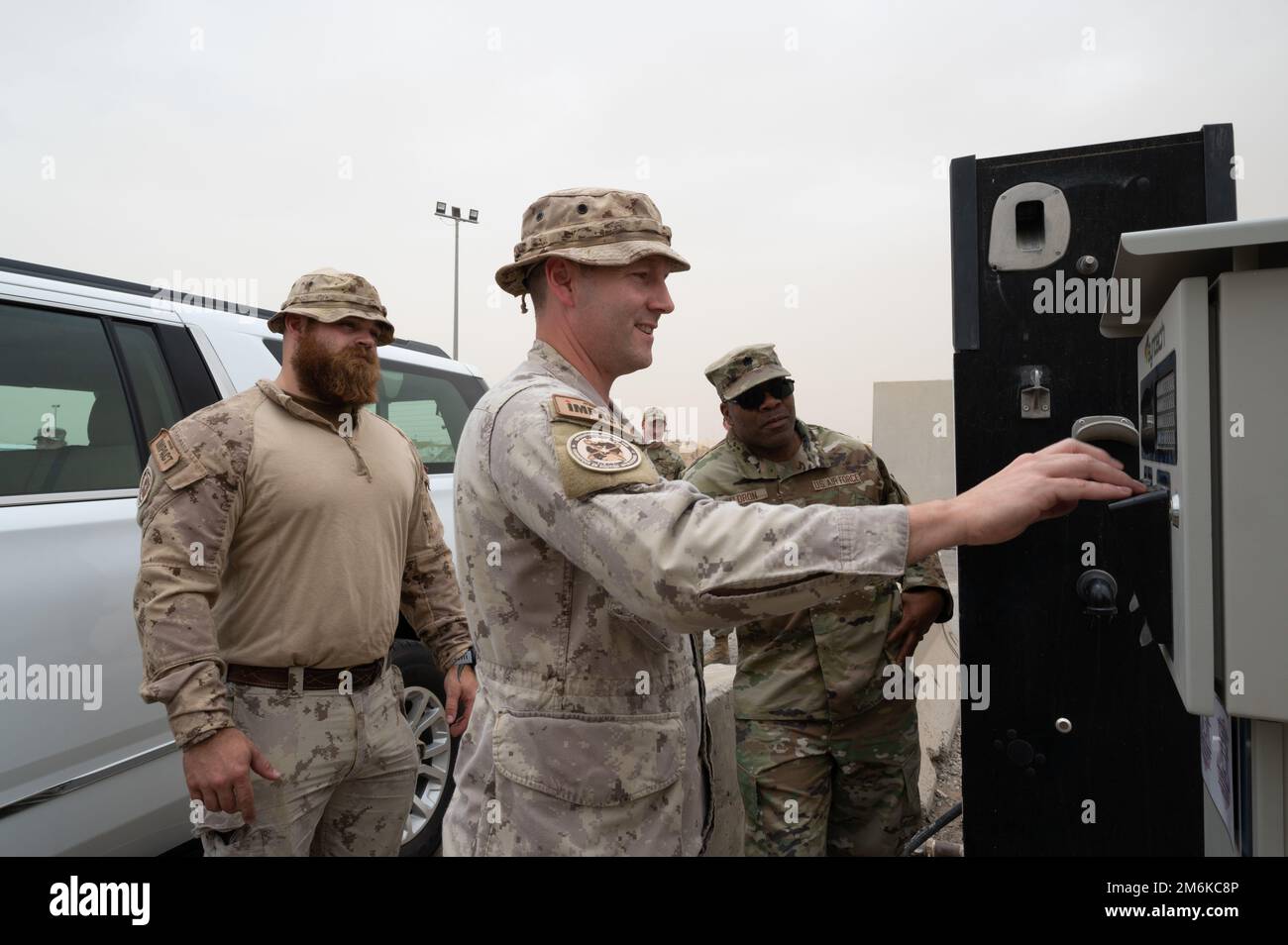Canadian Army Master Warrant Officer Martin Blais, vehicle fleet manager, Osh-Swa, Joint Task Force-IMPACT, enters his vehicle’s license plate number in a new automated fuels service pedestal before pumping gas at Pump 3 at Ali Al Salem Air Base, Kuwait, April 29, 2022. The new automated fuels service replaces an outdated process and improves billing and tracking efficiency, speed and accuracy. Stock Photo