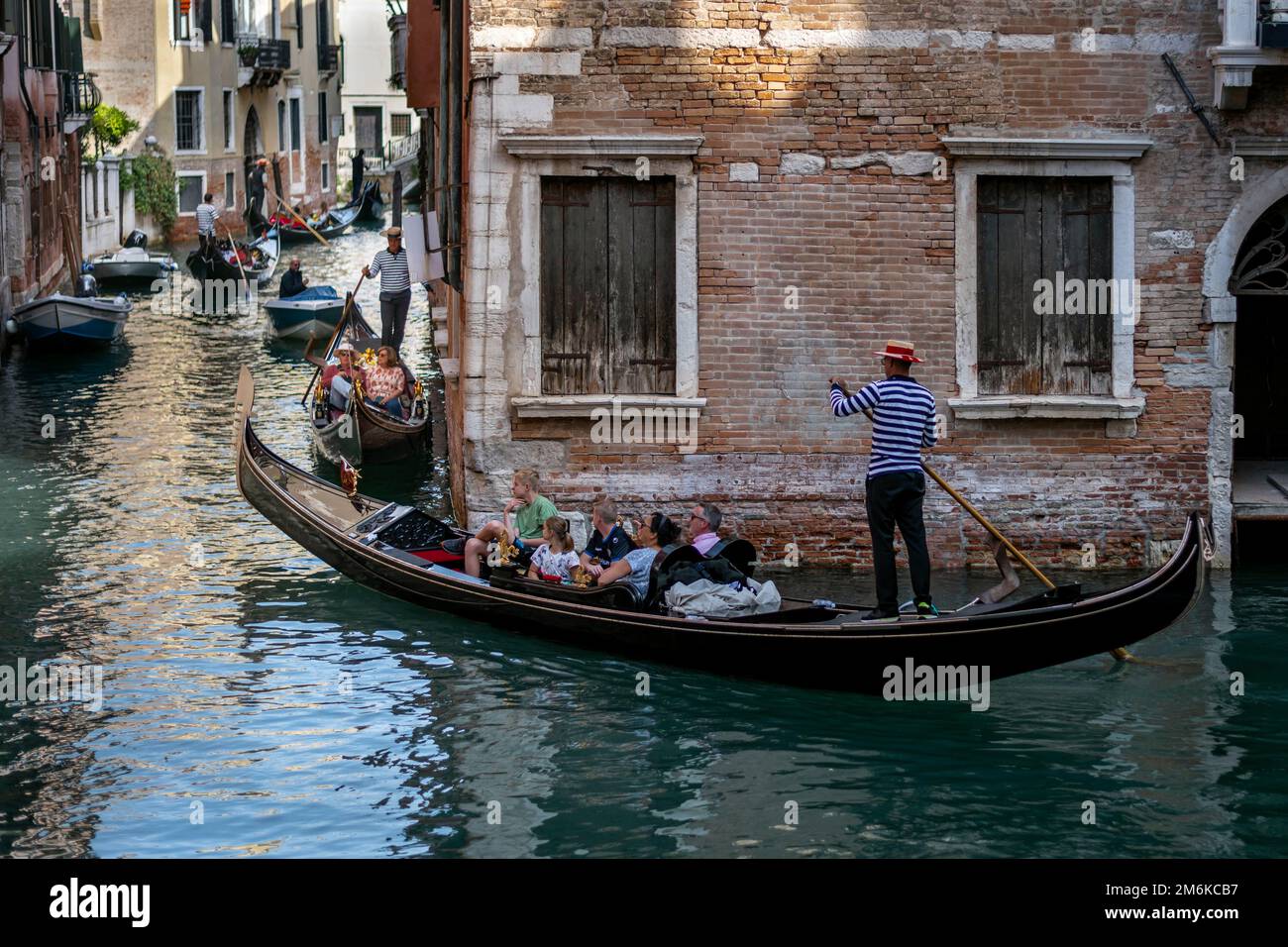 Gondola, a traditional Venetian row boat on a canal in Venice, Italy Stock Photo
