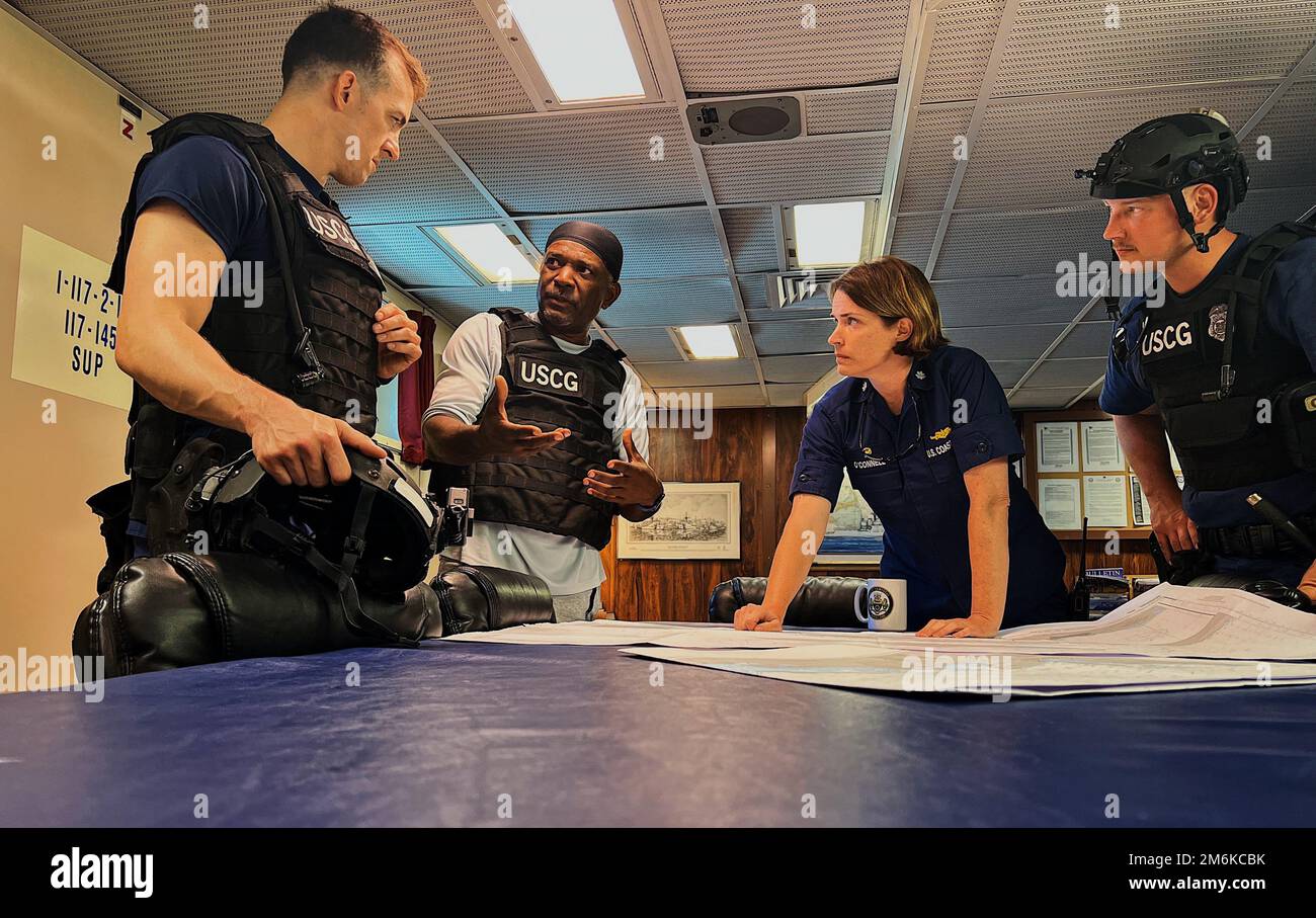 Coast Guard Cutter Campbell's Commanding Officer Anne O'Connell and two boarding officers work