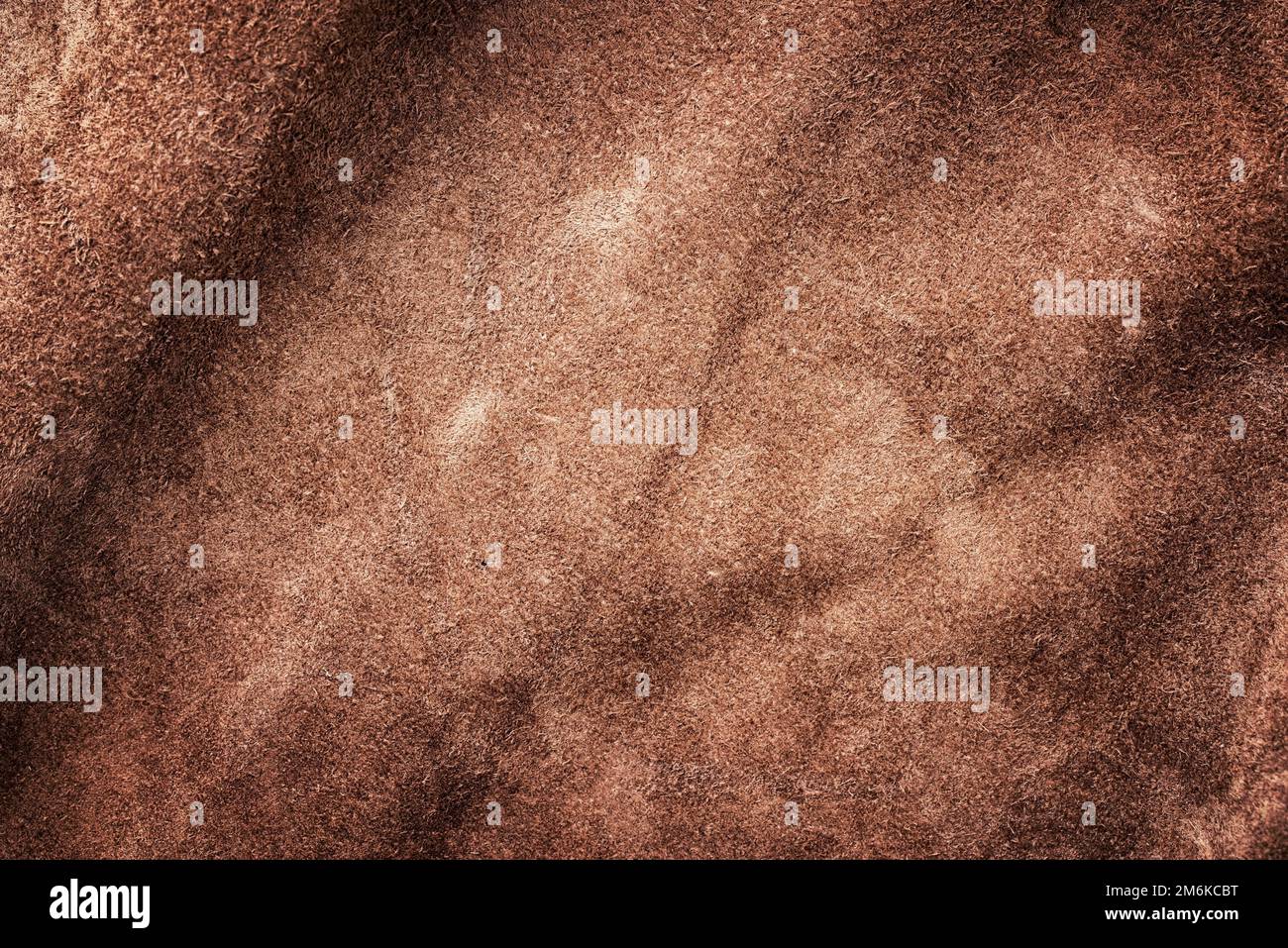 Brown vintage buckskin leather as background wallpaper with copy space