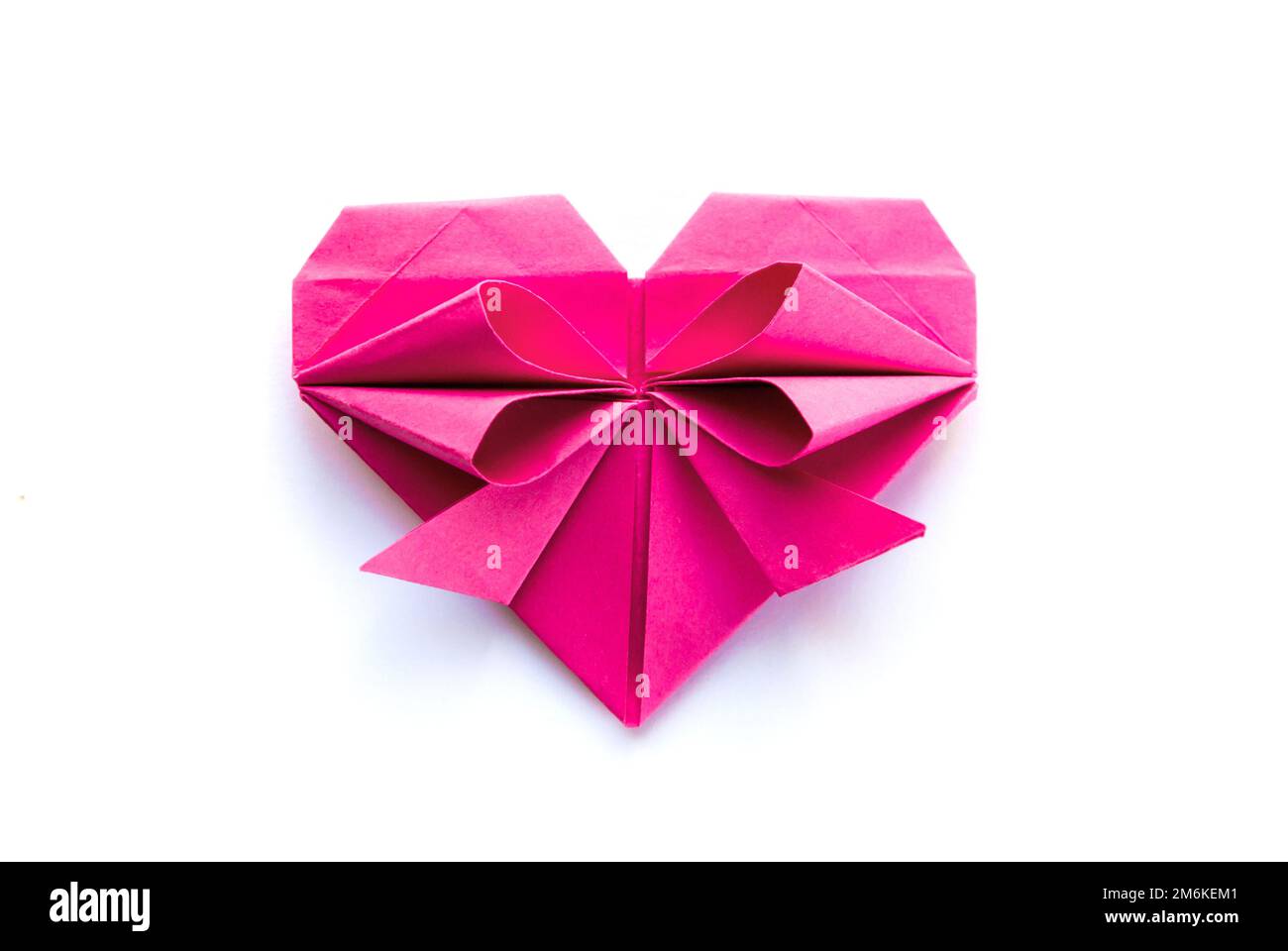 Pink paper heart origami isolated on a white background Stock Photo - Alamy