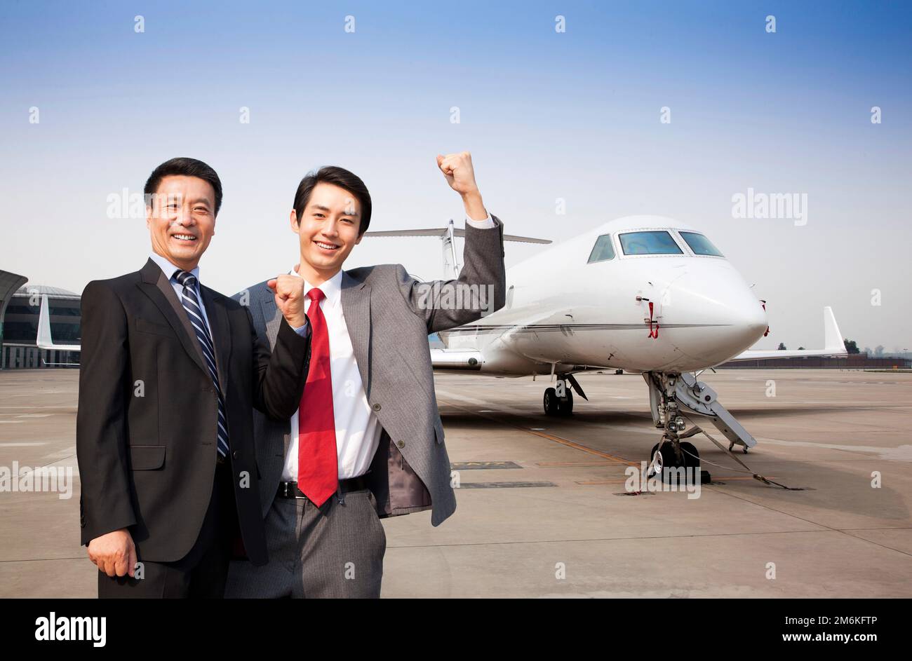 Business man and a private jet Stock Photo
