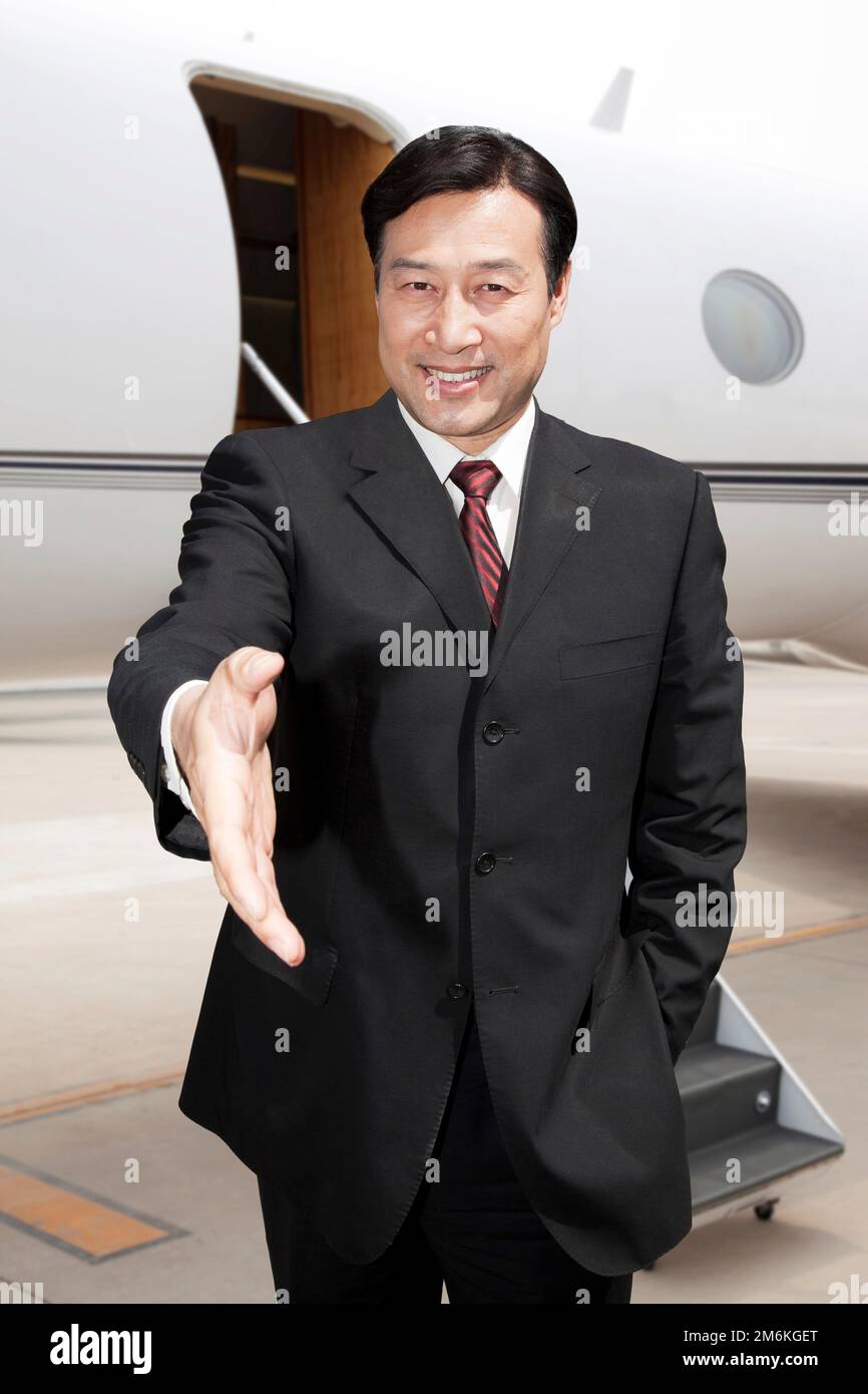 Business man and a private jet Stock Photo Alamy