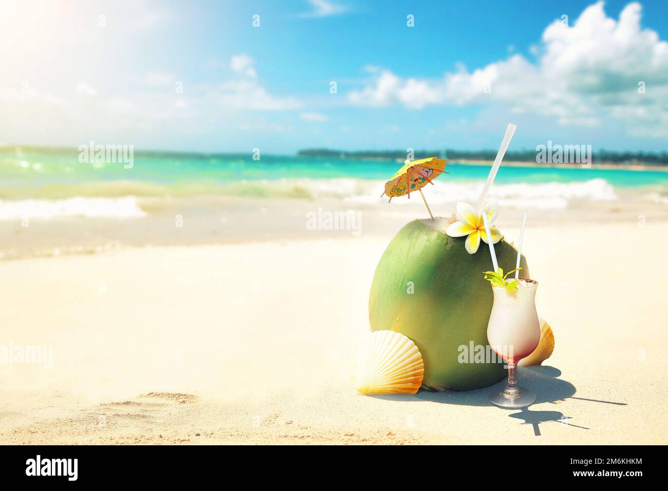 Summer coconut cocktail on the beach. Sunny day in topical island. Stock Photo