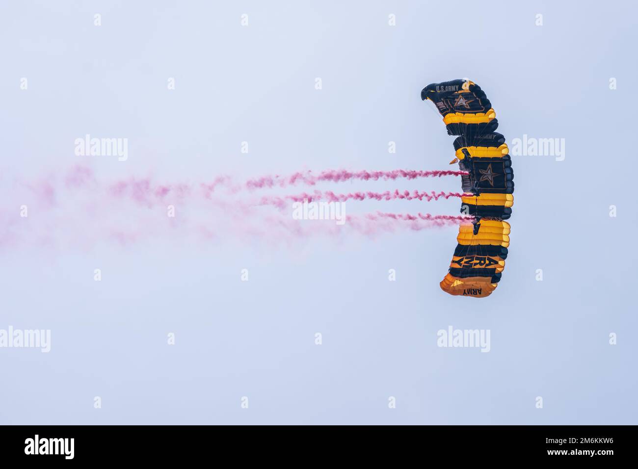 Members of the U.S. Army Parachute Team make a parachute jump over