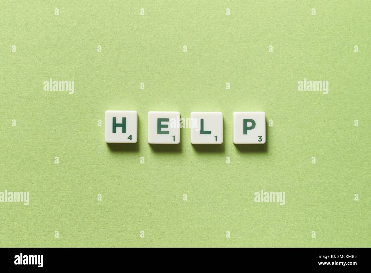 Help formed of scrabble blocks Stock Photo Alamy