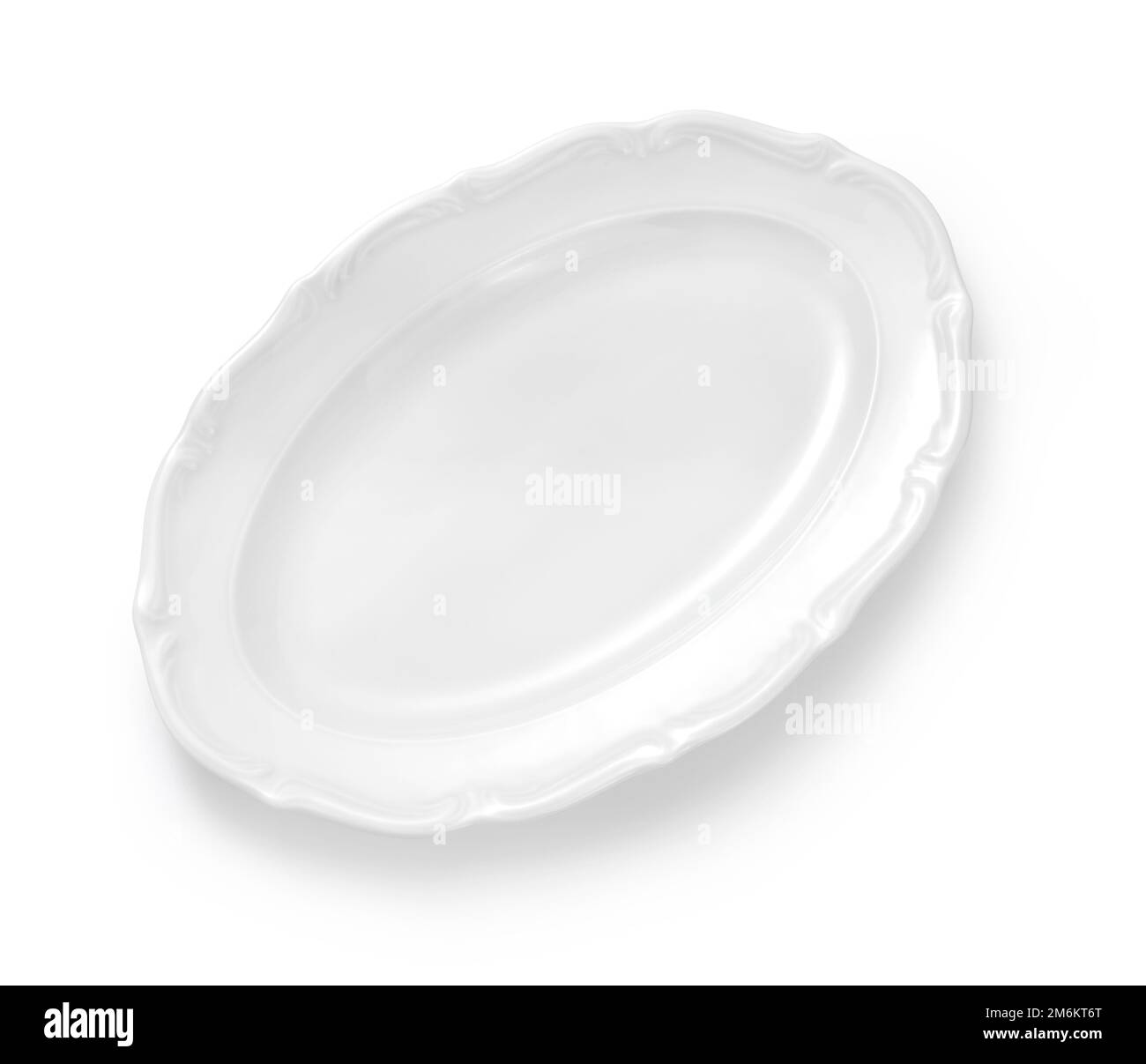 White porcelain plate isolated. Top view of oval plate on white Stock