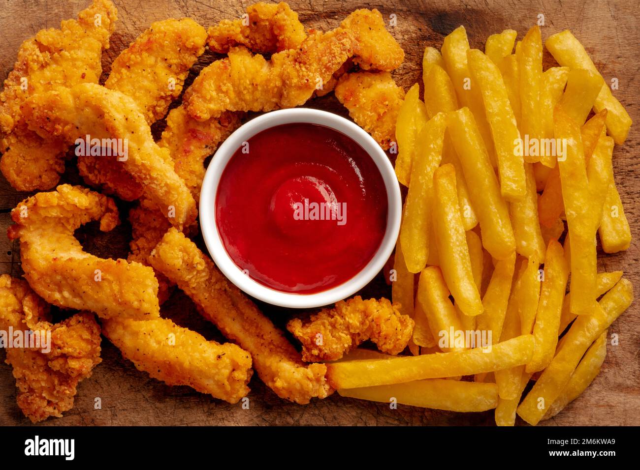 Chicken tenders, breaded and fried, with a barbecue sauce and French
