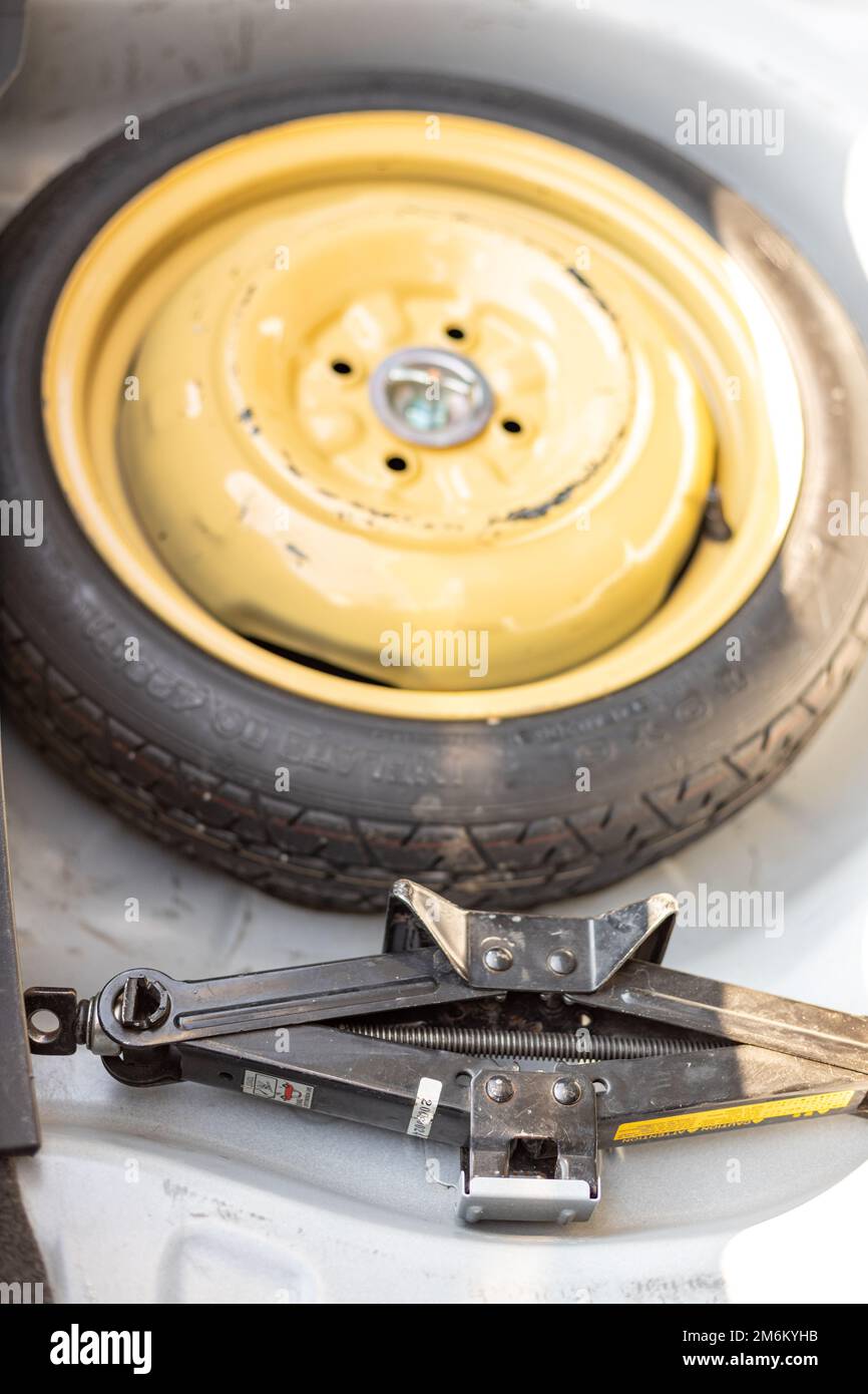 Spare wheel in the car trunk for emergency use Stock Photo Alamy