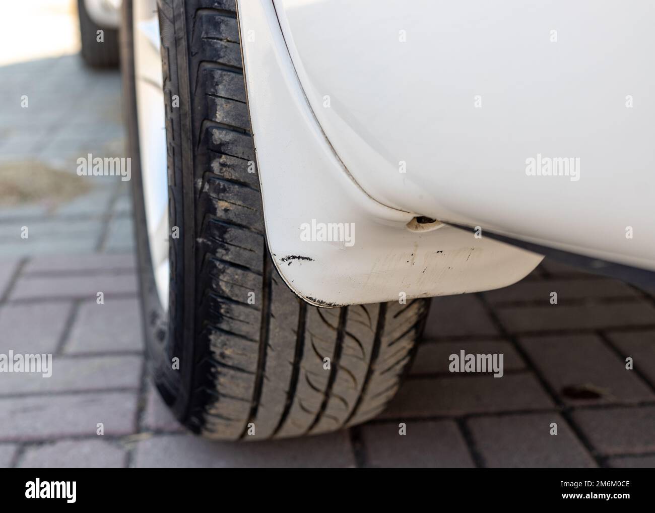 Car mudguard or mudflap of a rear wheel Stock Photo