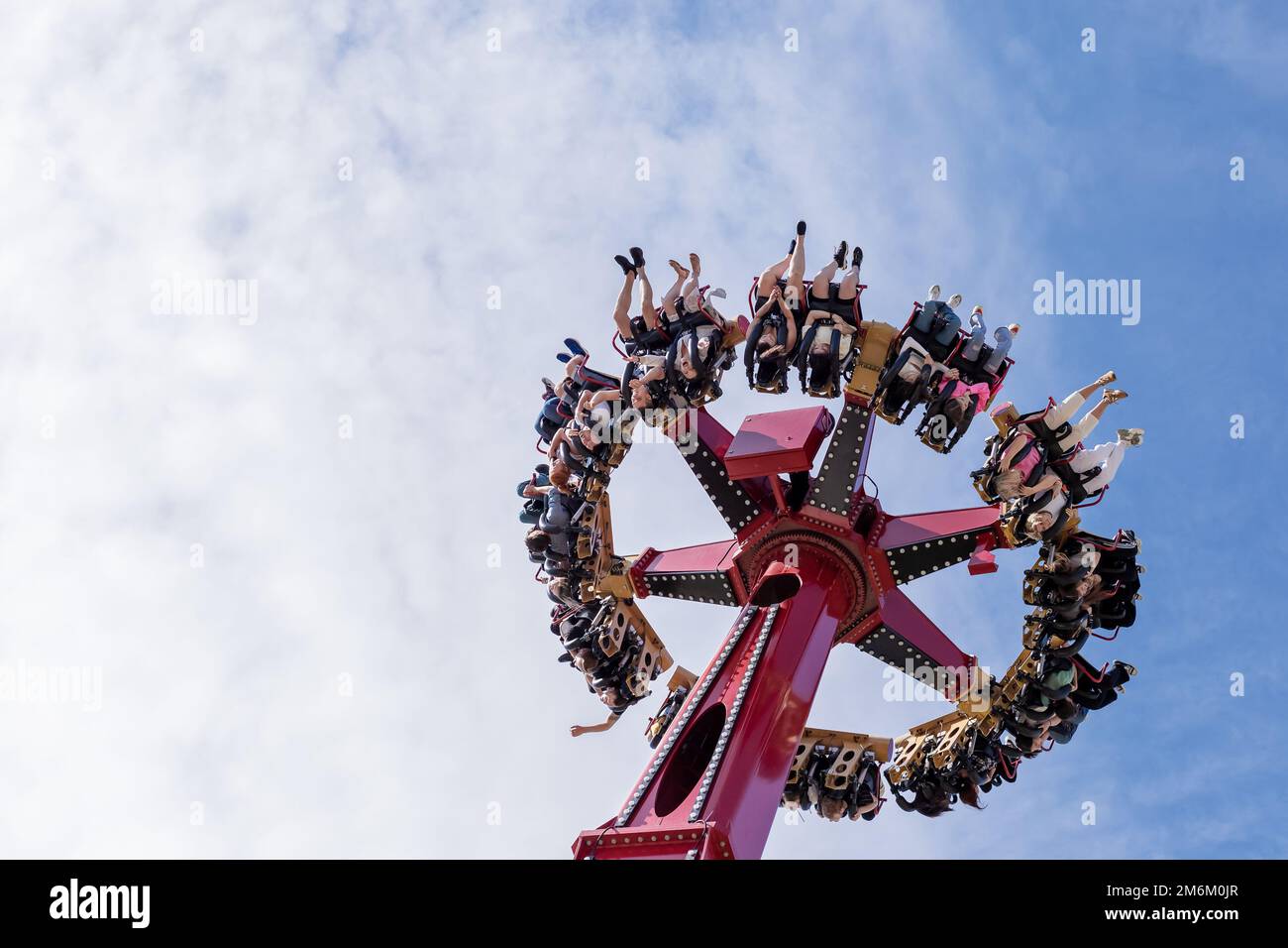 Russia, Sochi 14.05.2022. A huge round amusement ride turned the merry people upside down, raising them to the heavens. Extreme Stock Photo