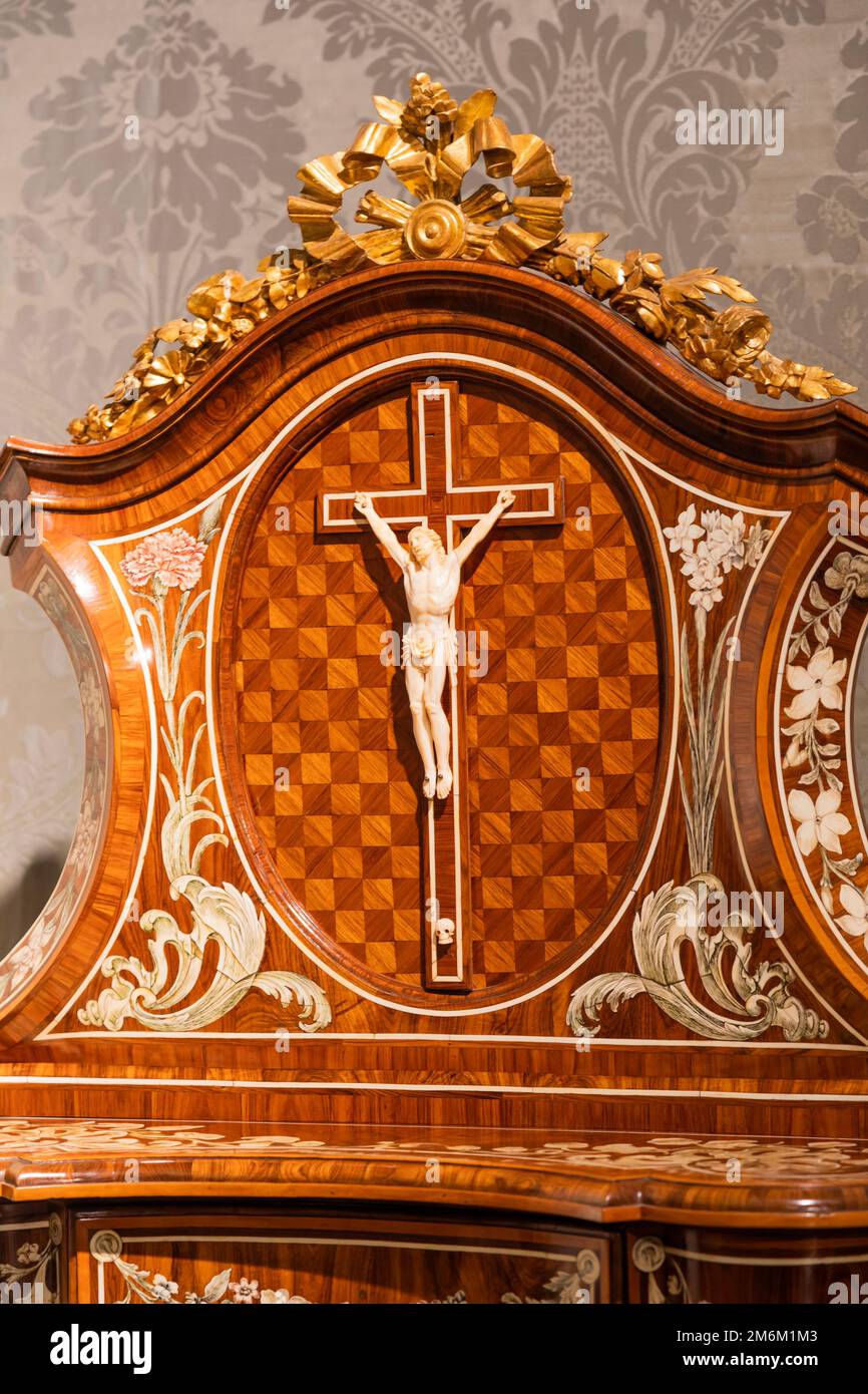 Old crucifix made of wood and ivory. Jesus Christ symbol of resurrection and life after the death. Stock Photo