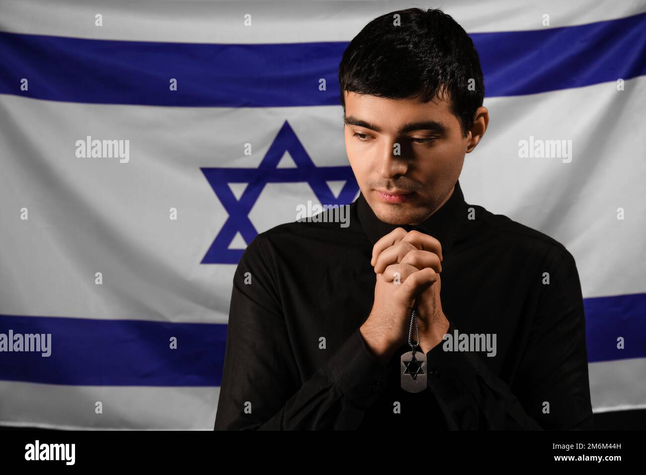 Jewish man against flag of Israel. Honoring victims of Holocaust Stock ...