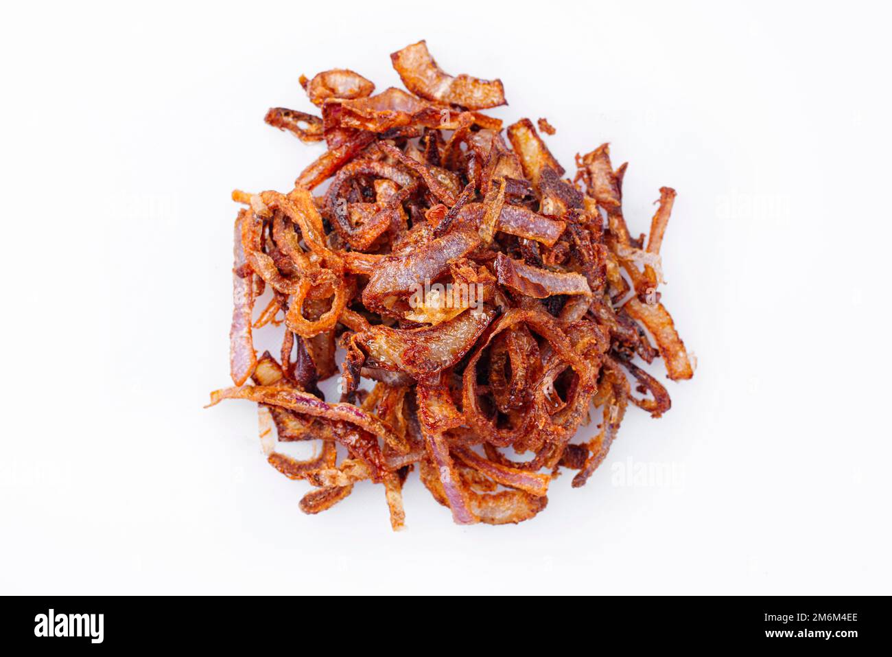 Traditional fried crispy onions rings backed in flour with chili served as close-up on white background with copy space â€“ isol Stock Photo