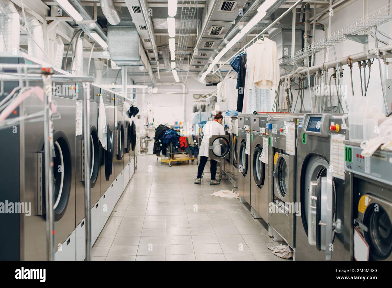 Dry cleaning clothes. Clean cloth chemical process. Laundry industrial dry-cleaning Stock Photo