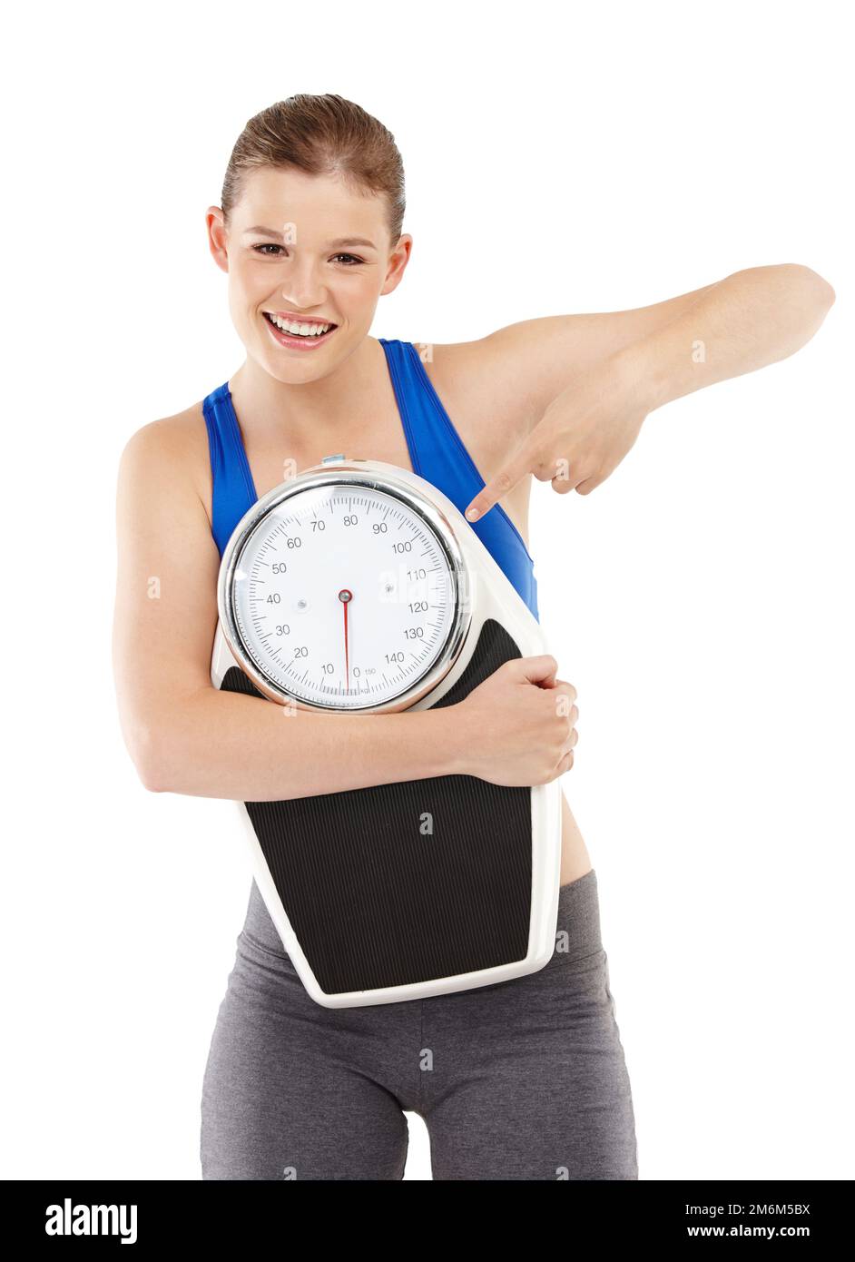 A woman standing on a weighing scale in white background with a lose weight  now note on its display Stock Photo - Alamy