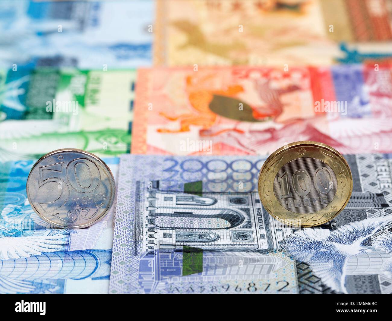 Kazakhstani coins - tenge on the background of money Stock Photo