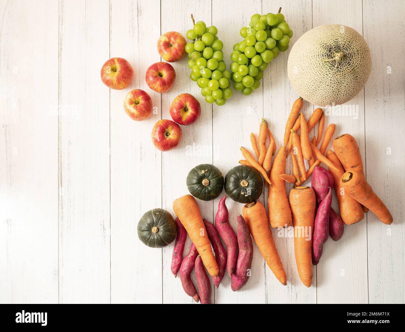 Various vegetables and fruits on wooden background Stock Photo