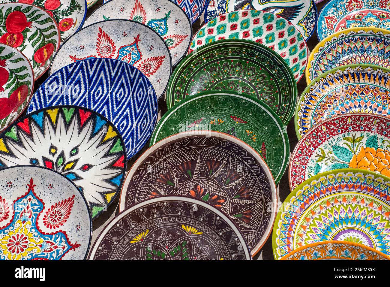 Decorative ceramic plates with traditional uzbek ornament in the street market of Bukhara. Uzbekistan Stock Photo