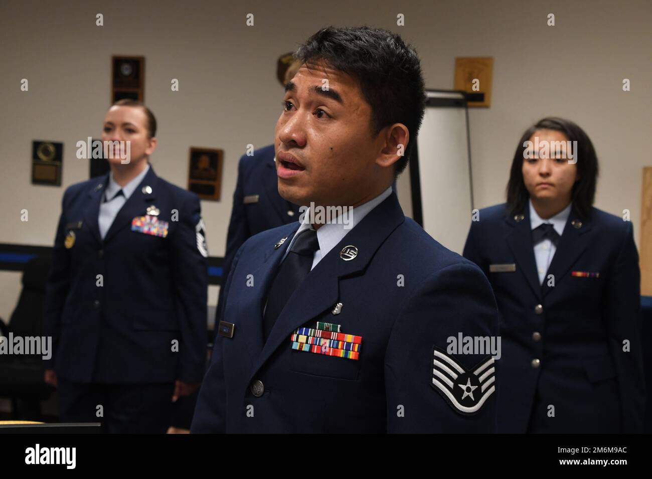 SSgt Brandon Ferrand of the 168th Medical Group, sings the national
