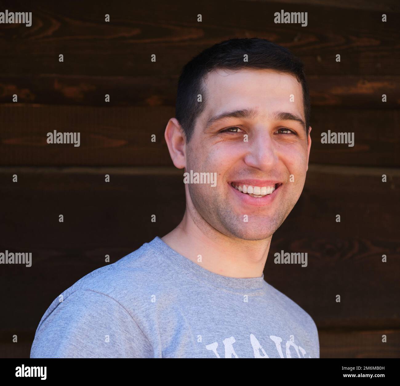 Headshot of a Teenage Boy Handsome young happy man smiling outdoors