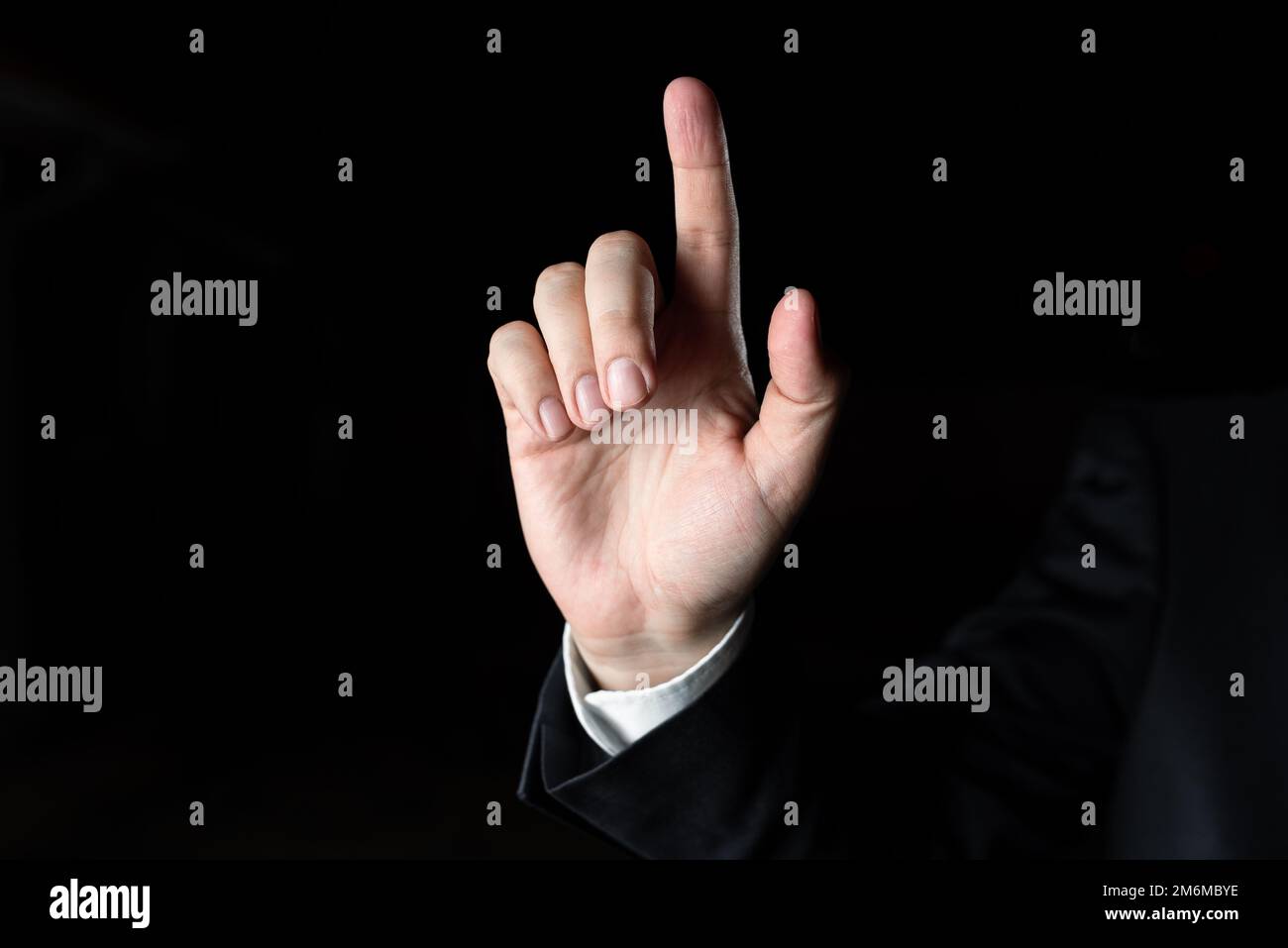One Finger Pointing Important Infortmations. Hand Presenting Crutial Announcement. Man Showing Recent Updates. Executive Display Stock Photo