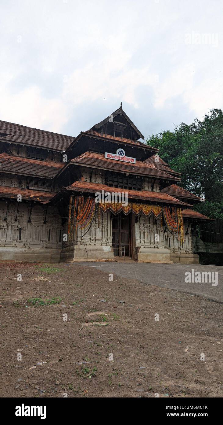 entrance of a historical temple of worship for hindus in kerala in the daytime Stock Photo