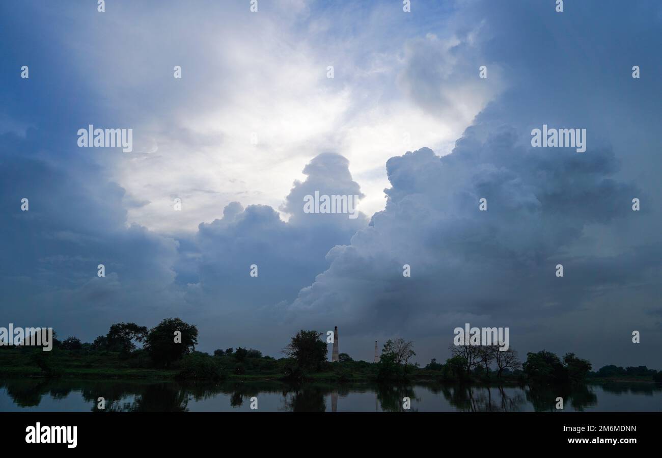 beautiful scene of cloudy sky weather with river or lake or pond ...
