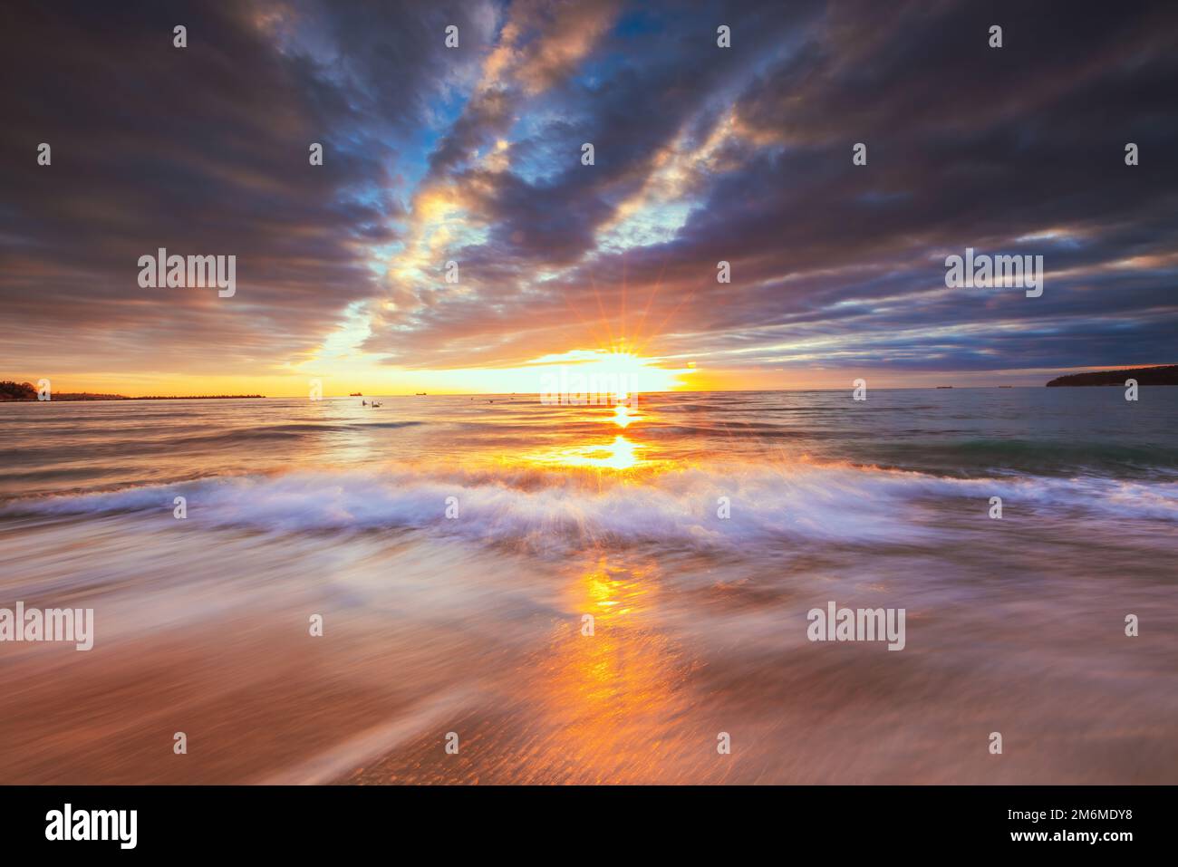 Beautiful cloudscape over the sea beach and shore, sunrise shot Stock ...
