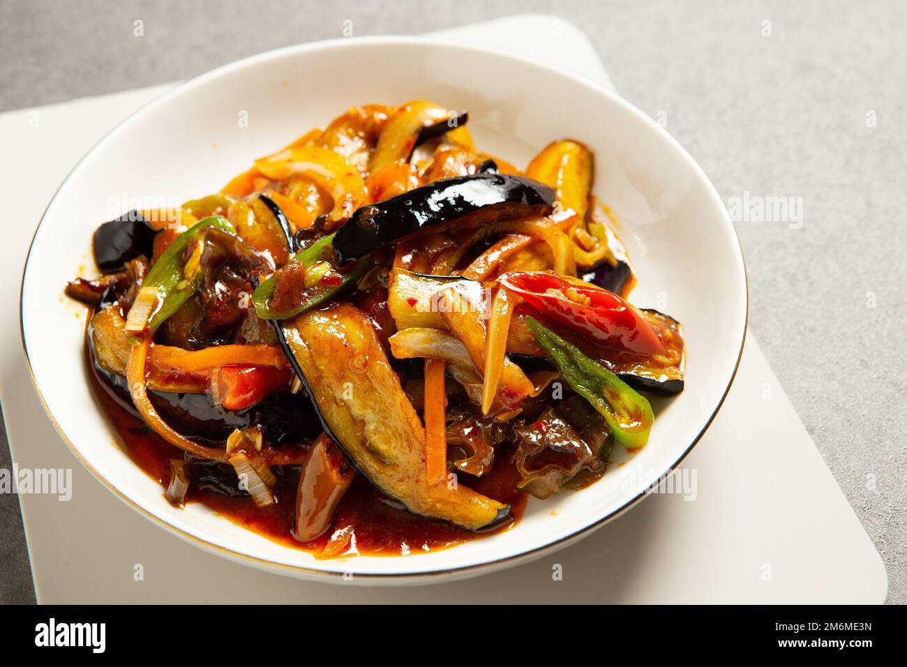 Stirfried eggplant and vegetables with spicy spices Stock Photo Alamy