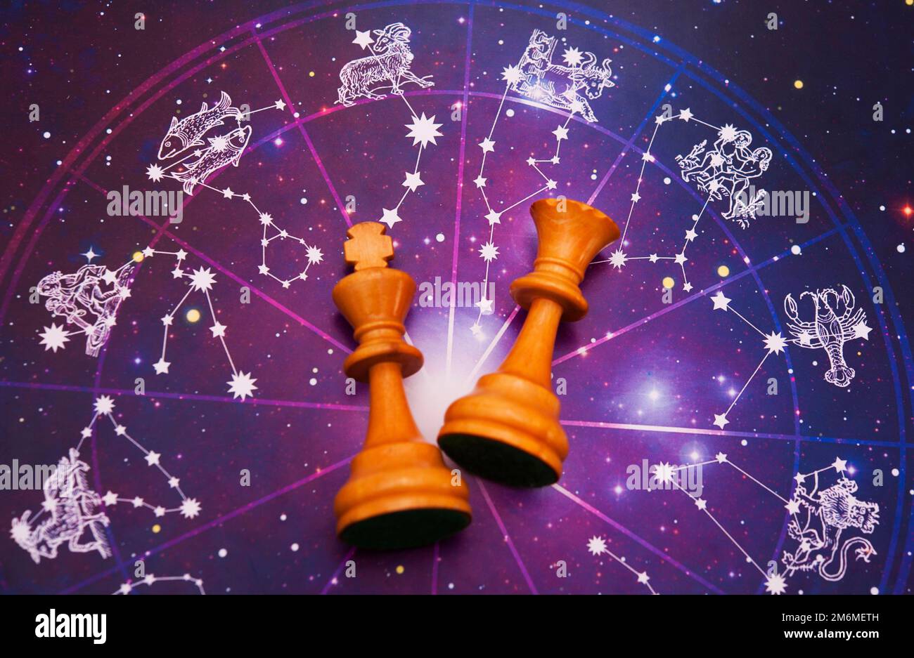 zodiac wheel and chess king and queen Stock Photo Alamy